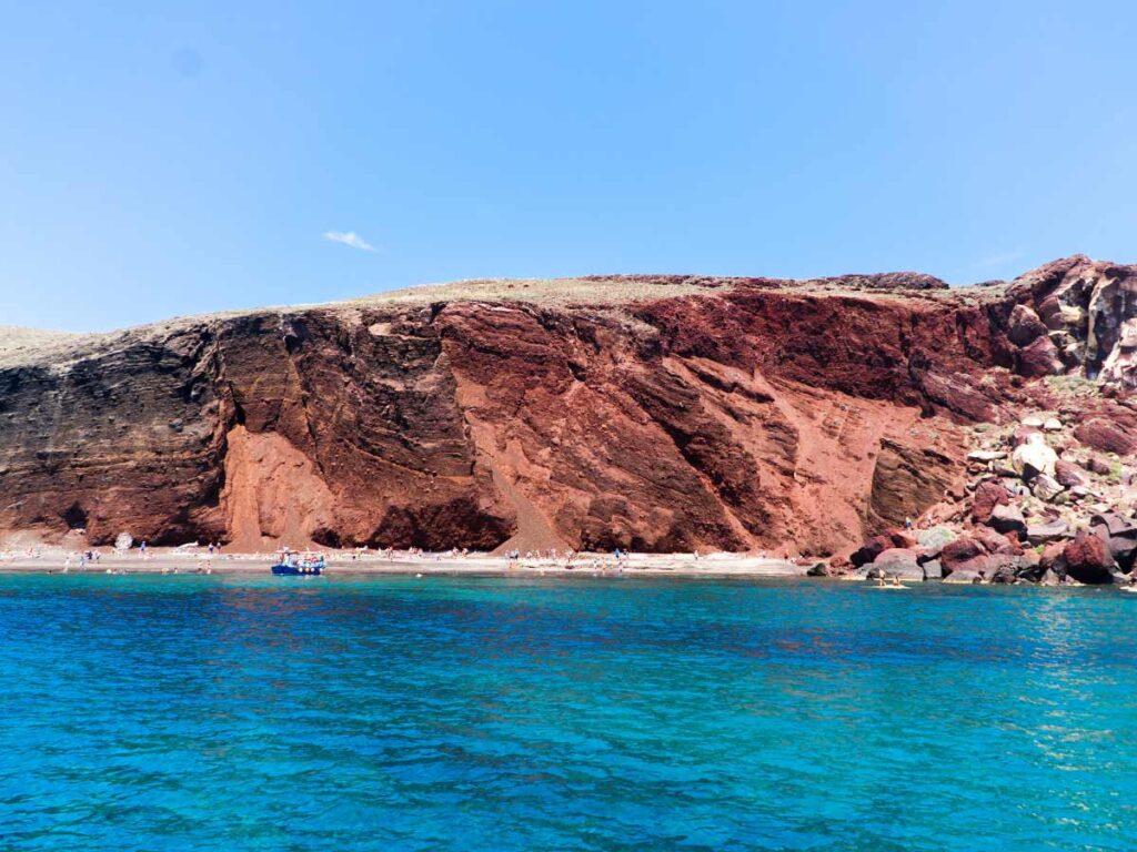 Red Beach in Santorini with striking volcanic cliffs and clear turquoise waters